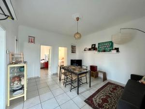 a living room with a table and a dining room at Casa vacanze da Tonino in Noci +12 photos