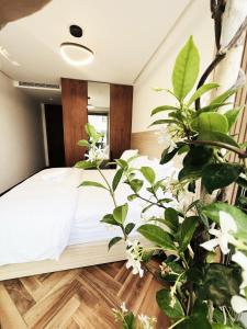 Ένα ή περισσότερα κρεβάτια σε δωμάτιο στο Harmony Garden