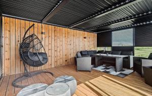 a room with a patio with a table and chairs at Amazing Home In Tarm With Kitchen in Tarm +24 photos