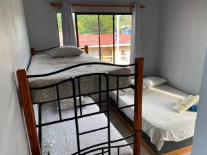Postel nebo postele na pokoji v ubytování Hotel Pacuare Turrialba
