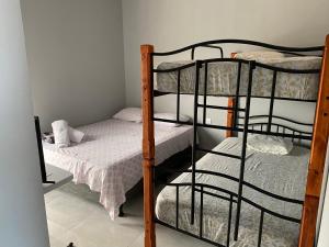Postel nebo postele na pokoji v ubytování Hotel Pacuare Turrialba