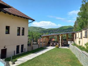 a view of a house with a yard at Vila Rakovica Ilidža Sarajevo in Sarajevo
