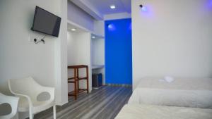 TV a/nebo společenská místnost v ubytování Dinuda Resort