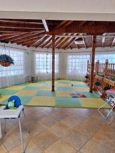 a large room with a large rug on the floor at Palma Beach Hotel in Kranevo