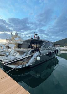 a boat is docked at a dock in the water at Yachts Cranchi60HT in Salerno