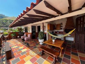 a patio with a hammock on a house at Loft Terraza Jericó in Jericó
