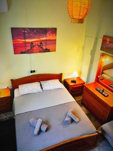 a bedroom with a bed with two pillows on it at Savvinio Country Apartment in Alexandroupoli