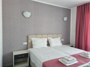 Postel nebo postele na pokoji v ubytování Dani beach Sozopol