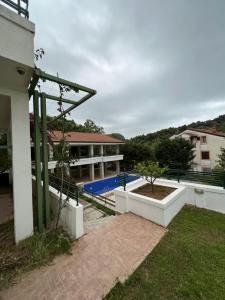 a view of a house with a swimming pool at Renome in Petrovac na Moru