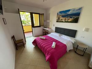 Postel nebo postele na pokoji v ubytování Agriturismo Piccolo Paradiso
