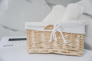 a basket with a white bow on top of a table at Villa Grammy in Bol +25 photos