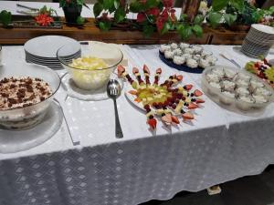 a table topped with bowls and plates of food at Hotel & Restaurant Bella Italia in Niederfell +2 photos