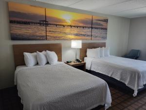 Postel nebo postele na pokoji v ubytování Days Inn & Suites by Wyndham Laredo + 21 fotografií
