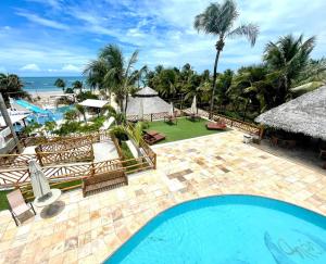 an aerial view of the pool and beach at Hotel das Marés in Trairi