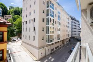 an apartment building under construction next to a street at Skenderpasina Skyline 2-bedroom apartment with balcony in Sarajevo