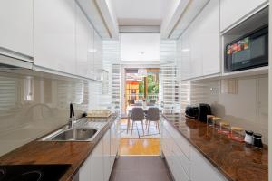 a kitchen with a sink and a counter top at Skenderpasina Skyline 2-bedroom apartment with balcony in Sarajevo