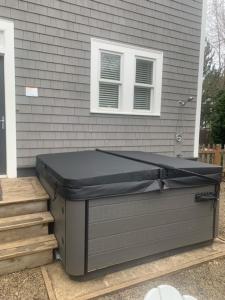 a building with a dumpster in front of a house at Beaches-N-Cream by Seabrook Hospitality in Pacific Beach