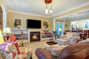 a living room with a couch and a fireplace at Beaches-N-Cream by Seabrook Hospitality in Pacific Beach +48 photos