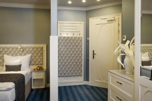 Voodi või voodid majutusasutuse EA Hotel Atlantic Palace toas