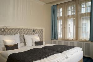 Voodi või voodid majutusasutuse EA Hotel Atlantic Palace toas
