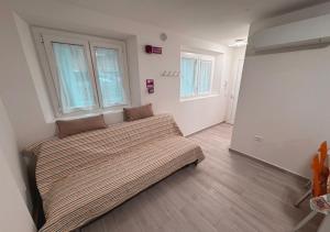 Postel nebo postele na pokoji v ubytování chiAma Hotel