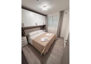 Postel nebo postele na pokoji v ubytování chiAma Hotel