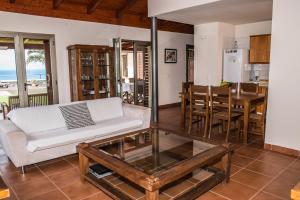 a living room with a couch and a table at Casa Tagoro, facing the Ocean in Tacoronte