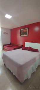 Ein Bett oder Betten in einem Zimmer der Unterkunft Guest House Renascer K&W
