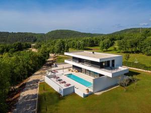 an aerial view of a house with a swimming pool at Villa She Luxury in Boškari