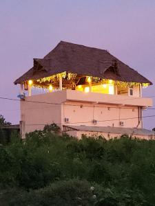 a building with lights on top of it at night at Cappadocia Hotel & restaurant in Nungwi