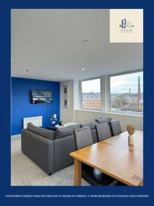 a living room with a couch and a table at Flat 507 Modern Luxury Living in Yeadon