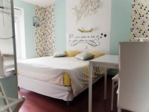 Postel nebo postele na pokoji v ubytování Les Victoriennes