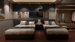 1 Schlafzimmer mit 2 Betten und einem Spiegel in der Unterkunft M&H Hotel in Ho-Chi-Minh-Stadt