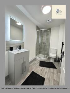 a bathroom with a shower and a sink and a toilet at Flat 501 Chic Apartment Living in Yeadon