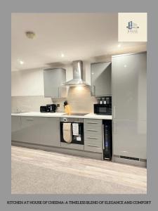 a kitchen with a stove and a microwave at Flat 501 Chic Apartment Living in Yeadon