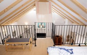 a room with a bed and a bench in a attic at 1 Bedroom Gorgeous Home In Vrisnik in Vrisnik +34 photos