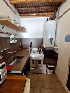 a kitchen with a stove and a sink at Bungalows Luz del sur in San Carlos de Bariloche +66 photos