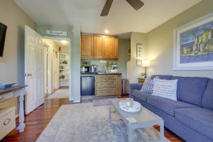 a living room with a blue couch and a table at Chic Peaceful Retreat 16 Mi to Beaches and Wineries! in Santa Paula +20 photos