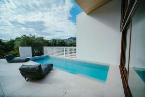 a swimming pool on the roof of a house at Habitals villa in Syvota