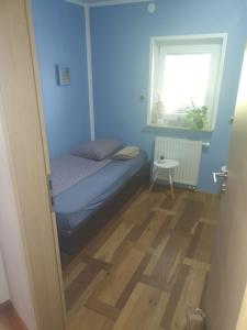 מיטה או מיטות בחדר ב-Sanja apartment near to Ljubljana
