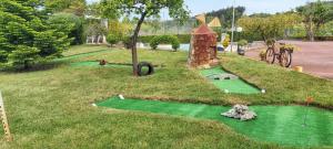 a miniature golf course in the middle of a park at One bedroom villa with private pool enclosed garden and wifi at Igreja Nova do Sobral in Sobral