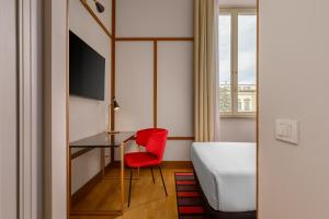 Cama ou camas em um quarto em Room Mate Luca, Florence