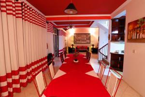 a room with two tables with red table cloths at RedHill Kandy in Kandy +47 photos