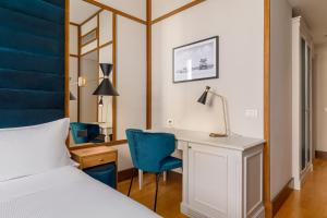 Cama ou camas em um quarto em Room Mate Luca, Florence