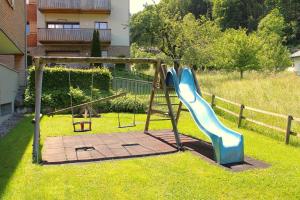 a playground with a slide in a yard at Verwall 1 Garten FeWo by Alpenfeder in Schruns-Tschagguns
