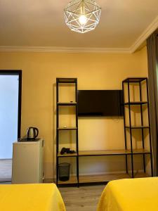 a bedroom with two bunk beds and a light at Magnet House in Ureki