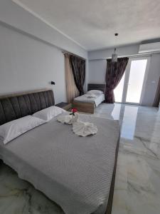 Postel nebo postele na pokoji v ubytování Eleni Hotel