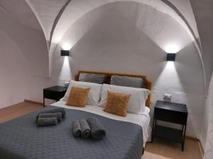 a bedroom with a large bed with two night stands at Dimora Apulia 5 in Gallipoli