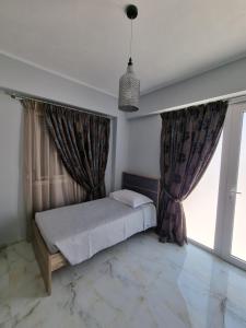 Postel nebo postele na pokoji v ubytování Eleni Hotel