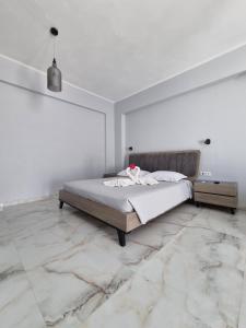 Postel nebo postele na pokoji v ubytování Eleni Hotel